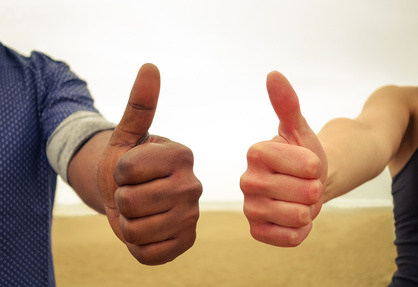 Thumbs up in favor of social equality